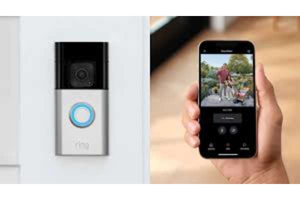 A hand holding a smartphone displaying a video feed from a Ring security camera. at AVIA Lofts on Victors Way, Boise, ID 83709
